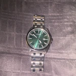 Citizen Eco-drive Men's Green Dial Date 100M Stainless Steel Bracelet Watch. Fixed Price $238.00.